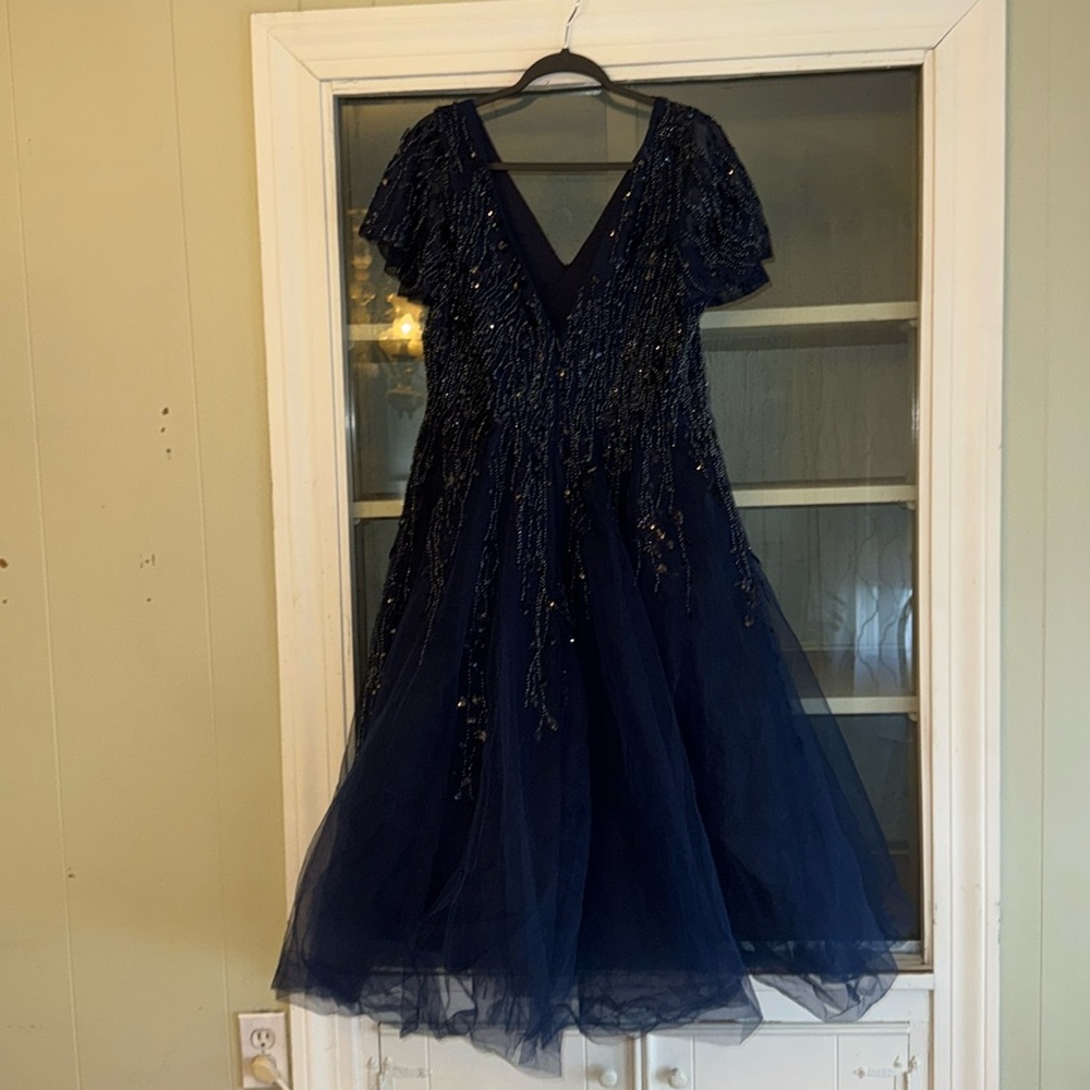 Beautiful cocktail blue sequin top and tule skirt. Perfect condition.